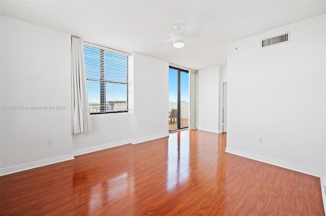 unfurnished room with light hardwood / wood-style floors