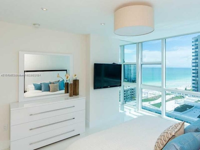 bedroom featuring a water view