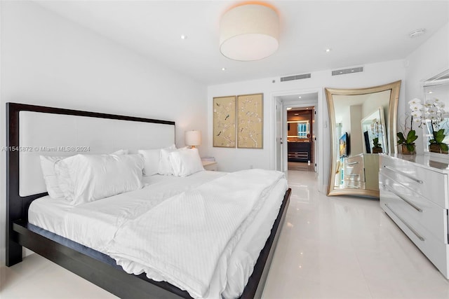 bedroom with light tile floors