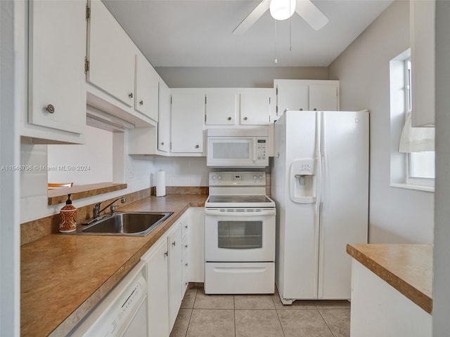 kitchen featuring ceiling fan, white appliances, sink, light tile floors, and white cabinets