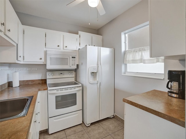 kitchen with white appliances, ceiling fan, white cabinets, backsplash, and light tile flooring