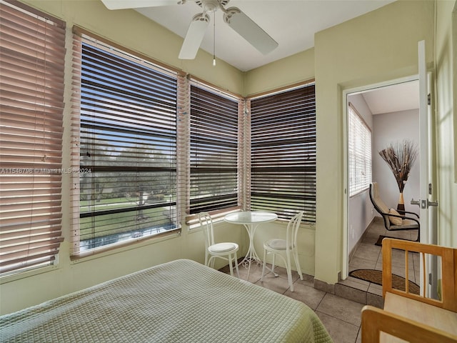 tiled bedroom with ceiling fan