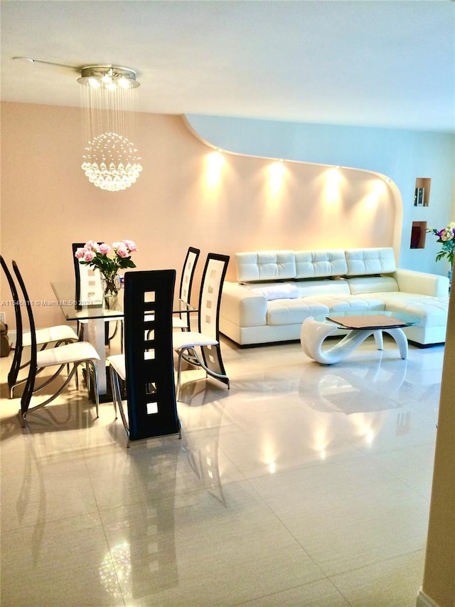 tiled dining area with a chandelier