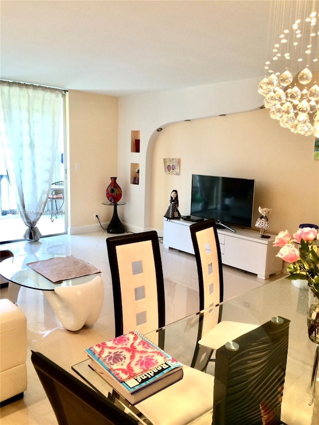 living room featuring light tile floors and a notable chandelier