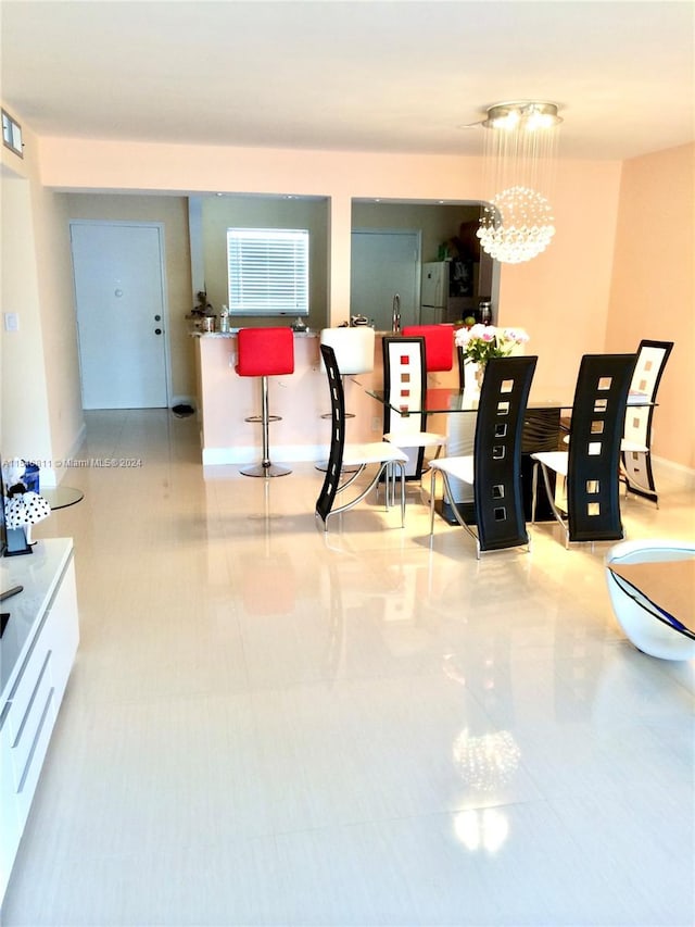 interior space with an inviting chandelier and light tile flooring