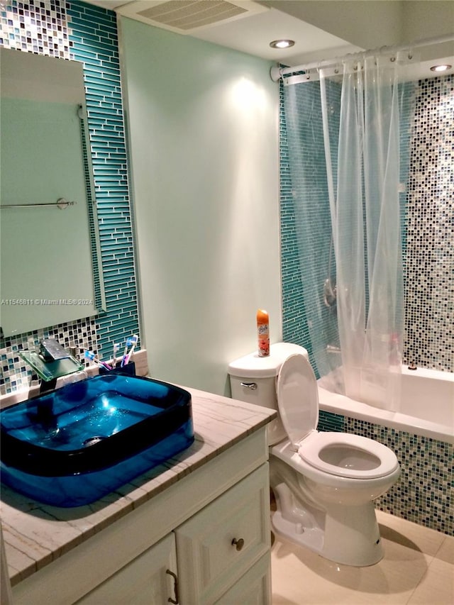 full bathroom with tile walls, toilet, tile flooring, oversized vanity, and shower / bathtub combination with curtain