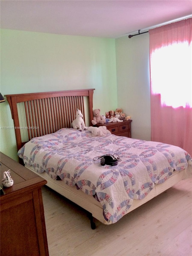 bedroom featuring light wood-type flooring