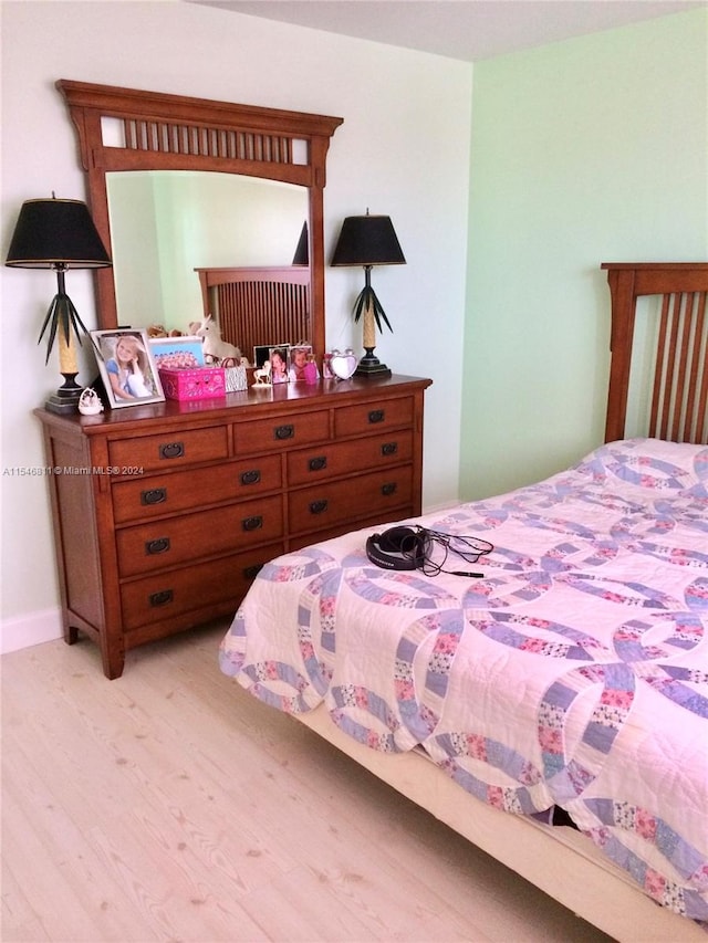 bedroom with light hardwood / wood-style floors