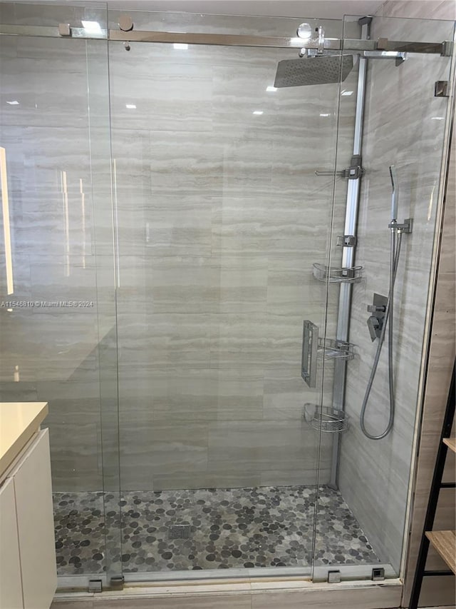 bathroom with vanity and an enclosed shower