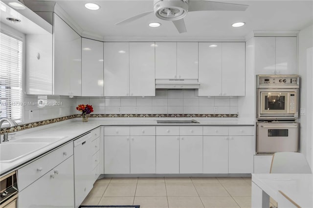 kitchen featuring white cabinets, backsplash, and ceiling fan