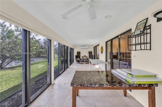 sunroom with ceiling fan