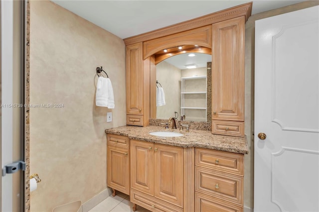 bathroom featuring tile floors and vanity