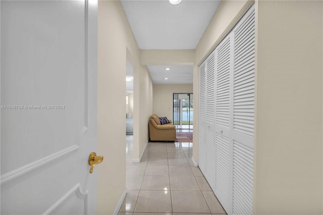 hallway featuring light tile floors