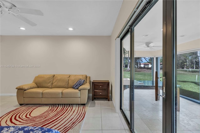 tiled living room featuring ceiling fan