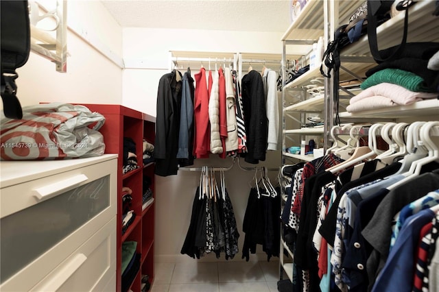 spacious closet featuring light tile floors