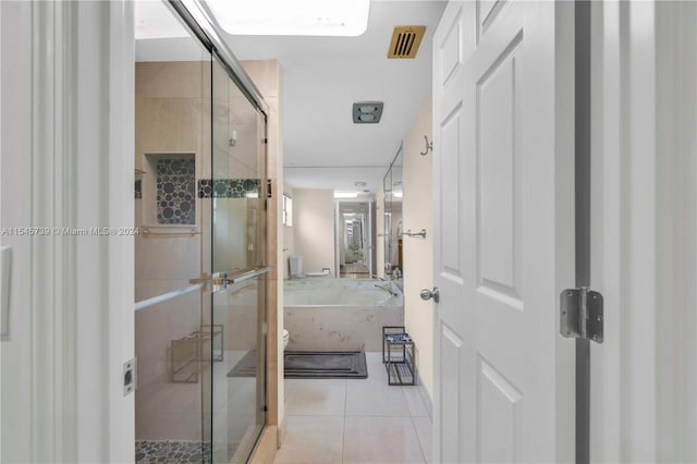 bathroom with plus walk in shower and tile floors