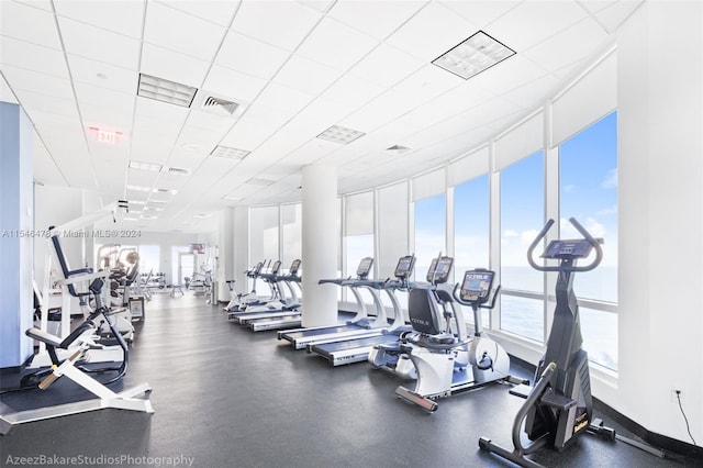 exercise room with a paneled ceiling