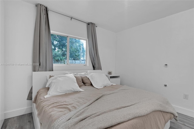 bedroom featuring hardwood / wood-style flooring