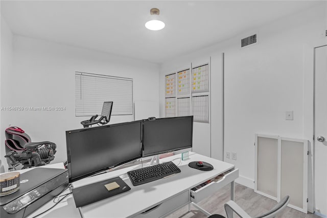 home office featuring light hardwood / wood-style floors