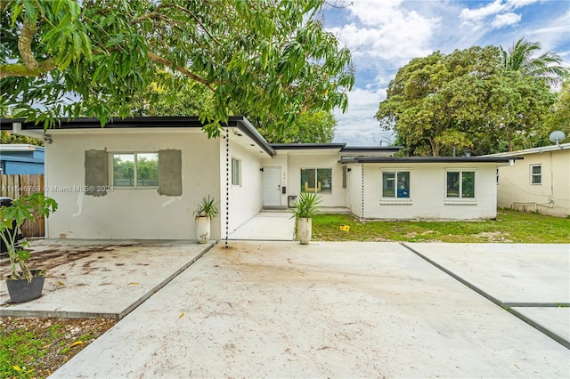 back of house with a patio area