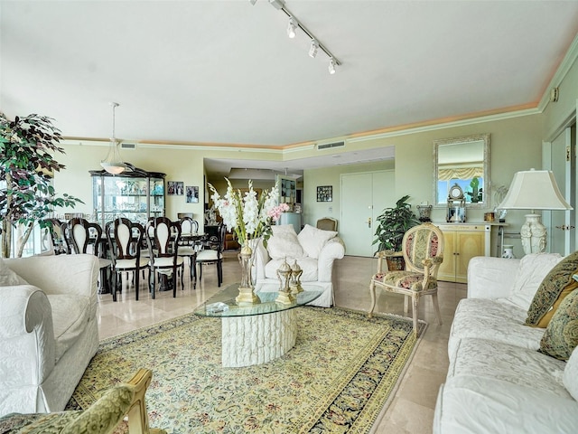 living room featuring ornamental molding, track lighting, and tile flooring