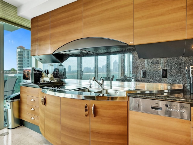 kitchen with tasteful backsplash, light tile flooring, and sink