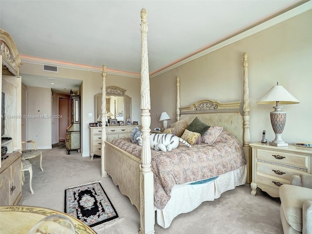 bedroom featuring crown molding and light colored carpet