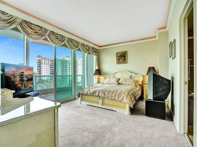 bedroom with carpet flooring, access to outside, and crown molding