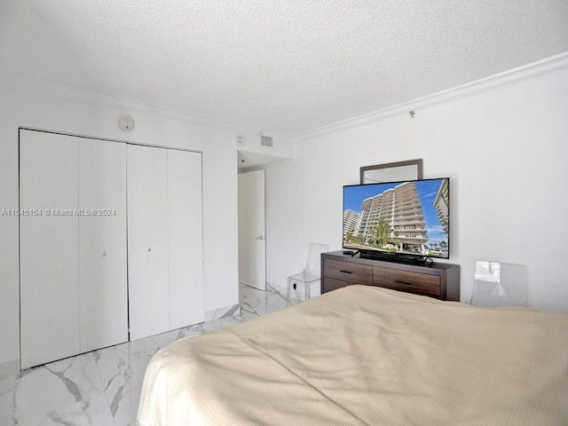 bedroom featuring ornamental molding, a closet, and a textured ceiling