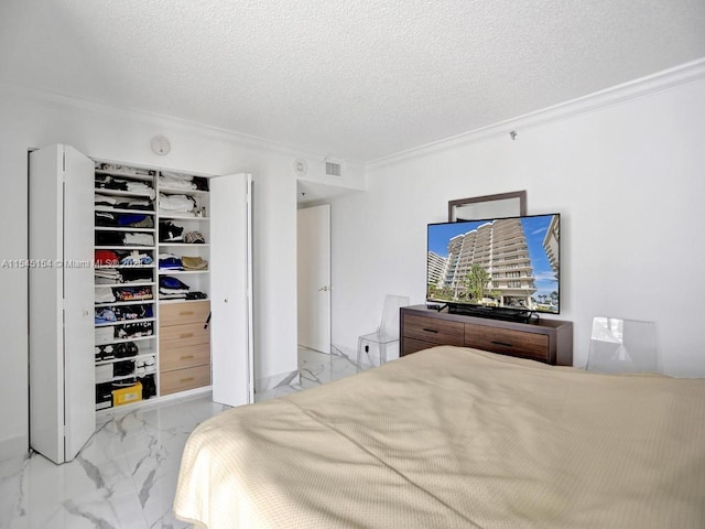 tiled bedroom with a textured ceiling and crown molding