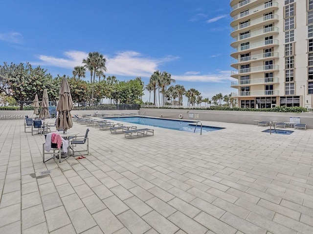 view of pool featuring a patio