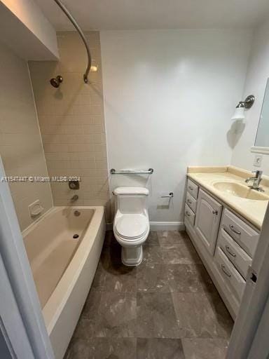 full bathroom with tiled shower / bath, toilet, tile flooring, and vanity