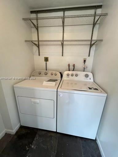 washroom featuring electric dryer hookup, washing machine and clothes dryer, and hookup for a washing machine