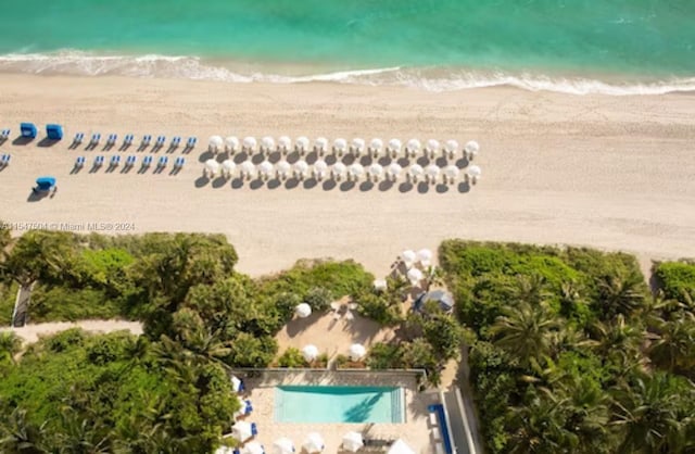 birds eye view of property featuring a beach view