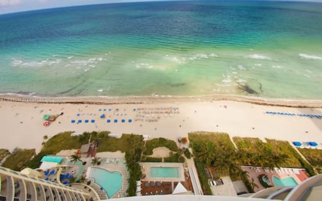 aerial view featuring a beach view and a water view