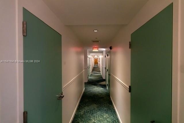 corridor with dark carpet