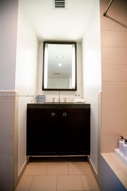 bathroom featuring vanity and tile flooring