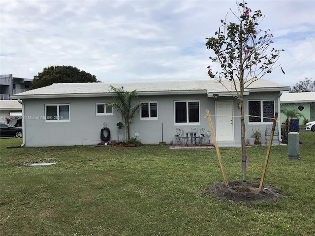 view of front of home with a front yard