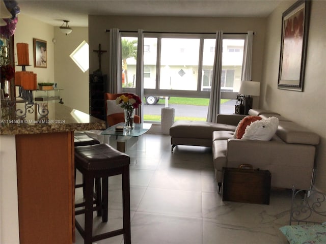 living room with light tile flooring