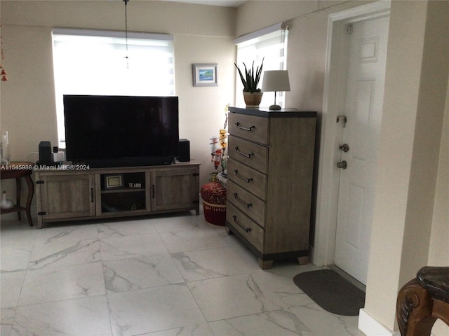 living room featuring light tile floors