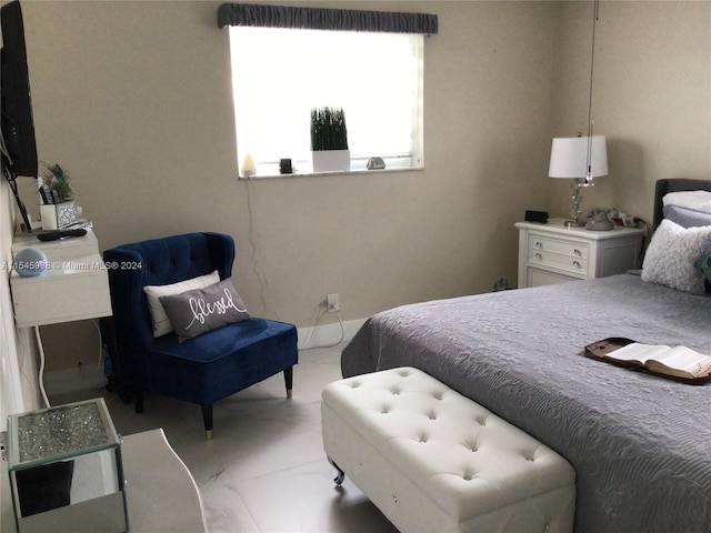 bedroom featuring light tile flooring