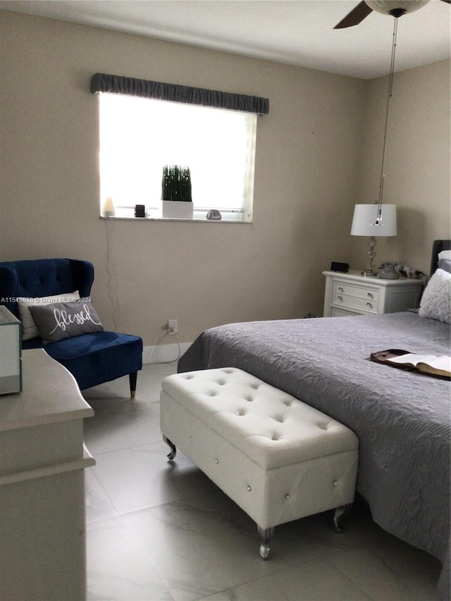 bedroom featuring light tile floors and ceiling fan