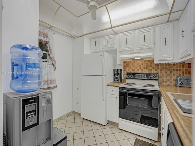 kitchen with ceiling fan, white appliances, white cabinetry, and tasteful backsplash