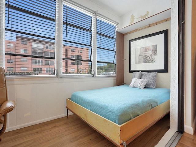 bedroom with light hardwood / wood-style flooring