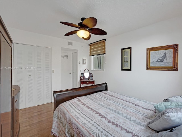 bedroom featuring hardwood / wood-style floors and ceiling fan