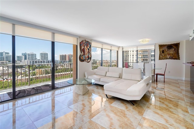 living room with light tile floors and floor to ceiling windows