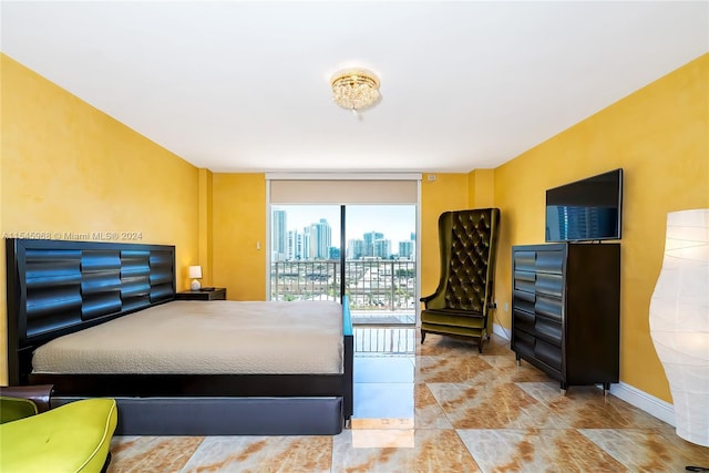 tiled bedroom featuring access to outside and floor to ceiling windows