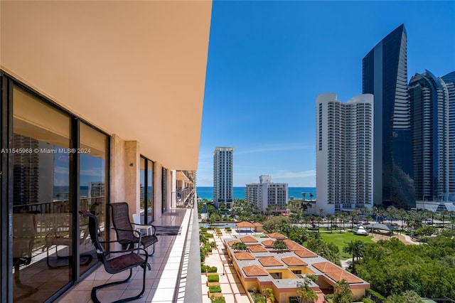 balcony featuring a water view