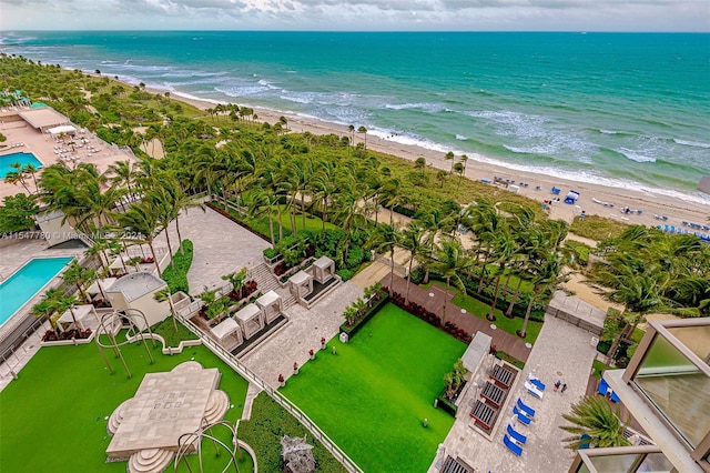 birds eye view of property featuring a view of the beach and a water view