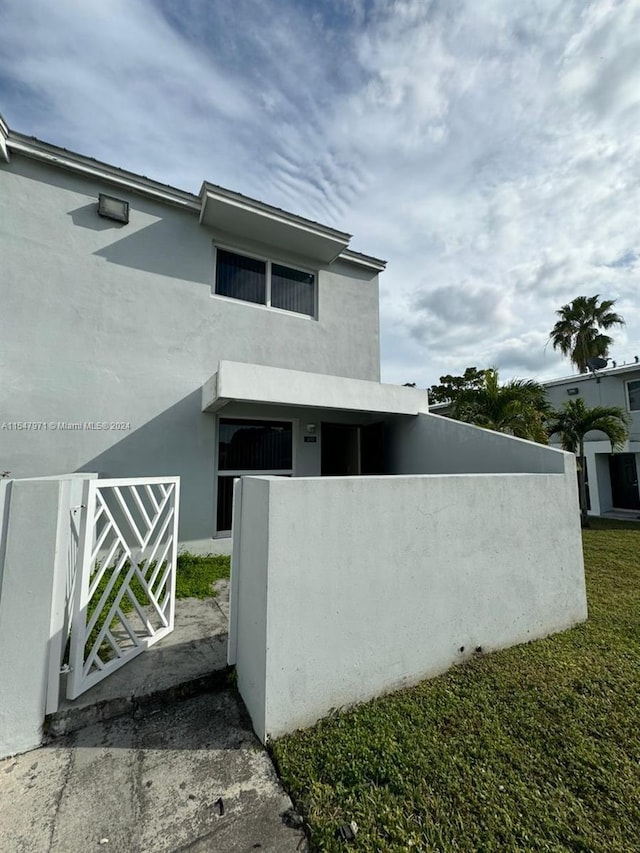 view of side of property with a yard